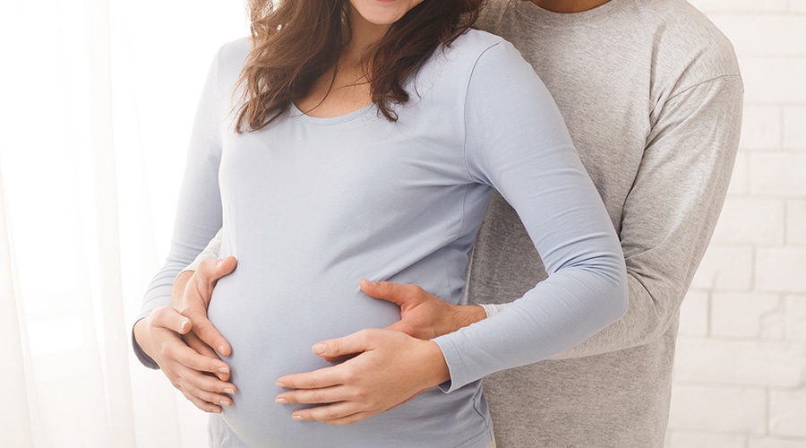 Parents holding their baby and planning for the future